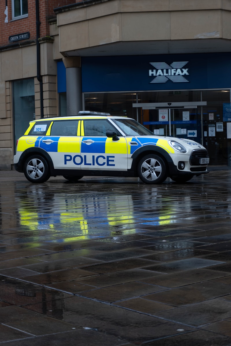 white and black police car on road